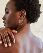 Person touching their shoulder