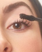 Person applying mascara
