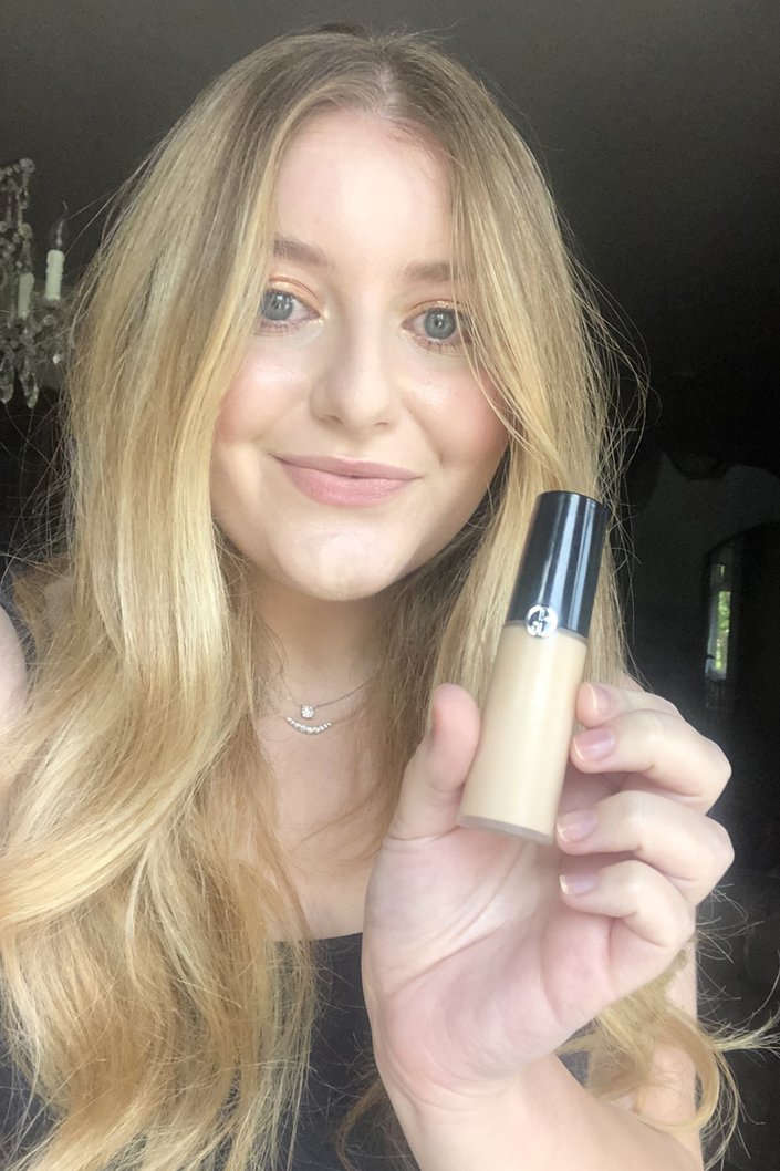 person posing with Giorgio Armani Luminous Silk Concealer