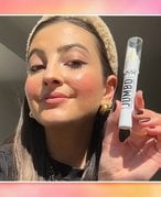 alanna holding the nyx jumbo multistick eye pencil 