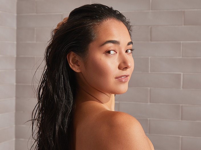 photo of person looking back at camera with wet hair