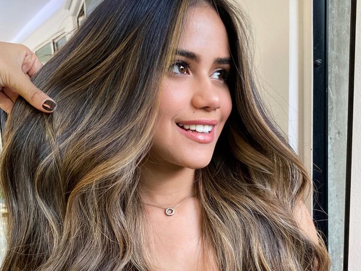 Person with long dark hair 