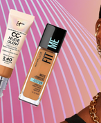 Smiling woman with gold jewelry and pink lipstick beside five foundation and concealer products on a pink and purple striped background.